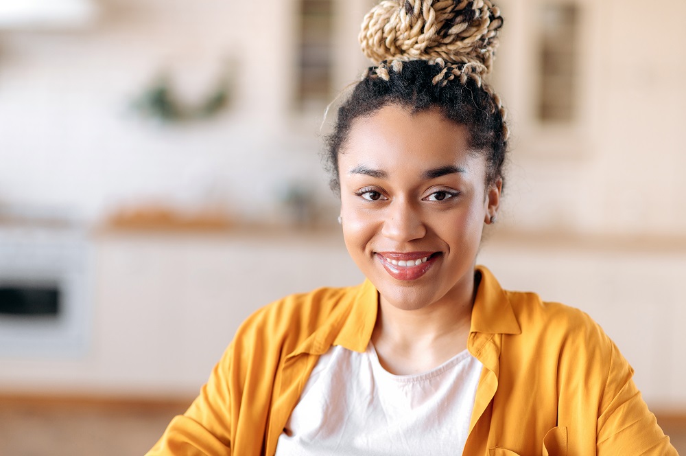 African American woman smiling indoors